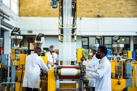 people working on machine